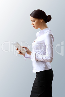 Young beautiful woman in business wear at work