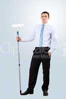 Young businessman with a paint brush