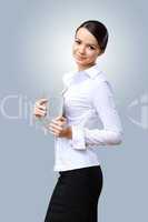 Young beautiful woman in business wear at work