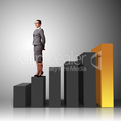 Businesswoman in suit standing near stairs