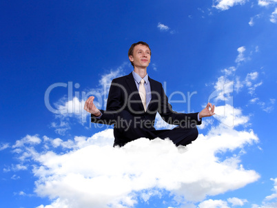Businessman in suit praying for success