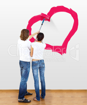 Young couple with paint brushes