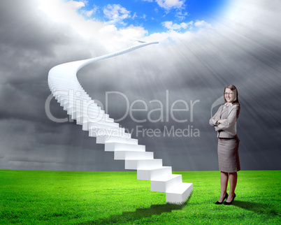 Businesswoman in suit standing near stairs