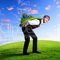 Young businessman carrying world