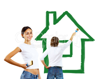 Young couple with paint brushes