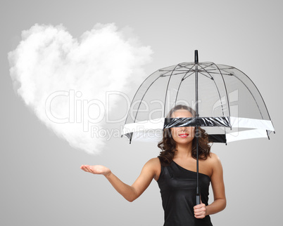 Pretty young woman with umbrella and hearts