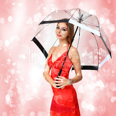 Pretty young woman with umbrella and hearts