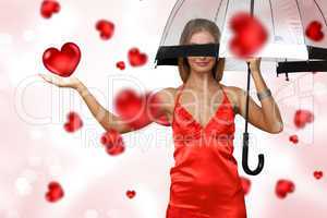 Pretty young woman with umbrella and hearts