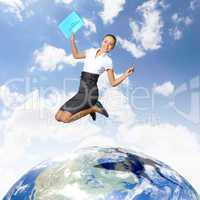 Young woman jumping and our planet earth