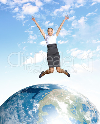 Young woman jumping and our planet earth