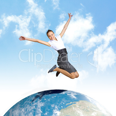 Young woman jumping and our planet earth