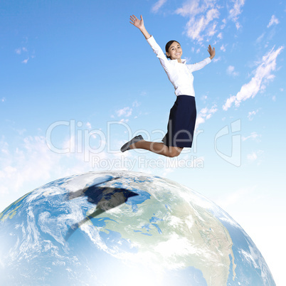 Young woman jumping and our planet earth