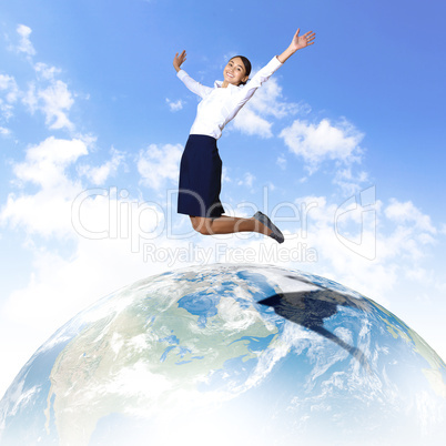 Young woman jumping and our planet earth