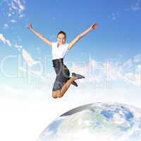 Young woman jumping and our planet earth