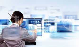 Businesswoman working with virtual digital screens