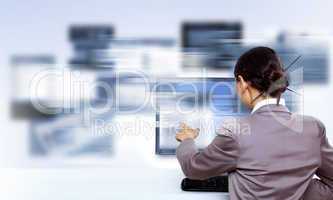 Businesswoman working with virtual digital screens