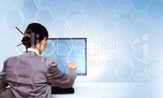 Businesswoman working with virtual digital screens