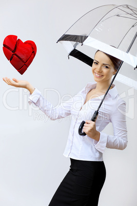 Woman with a red heart in her hand