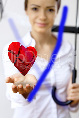 Woman with a red heart in her hand