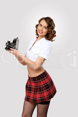 Young pretty woman dressed in retro style