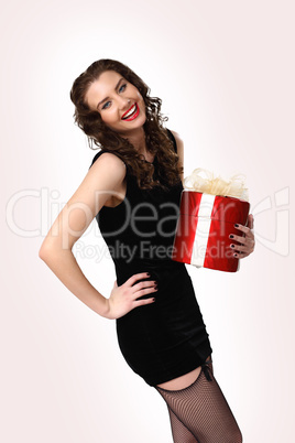 Woman in black dress with a gift box