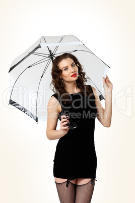 Woman dressed in retro style with umbrella