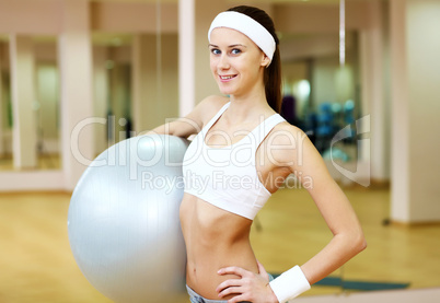 Woman in sport wear doing sport in gym