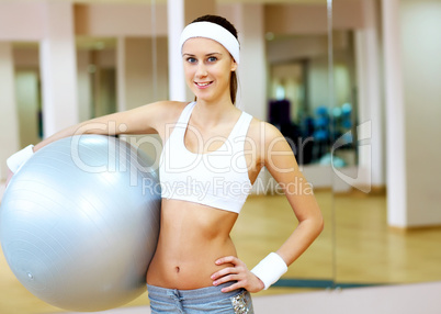 Woman in sport wear doing sport in gym