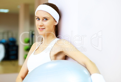 Woman in sport wear doing sport in gym