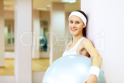 Woman in sport wear doing sport in gym