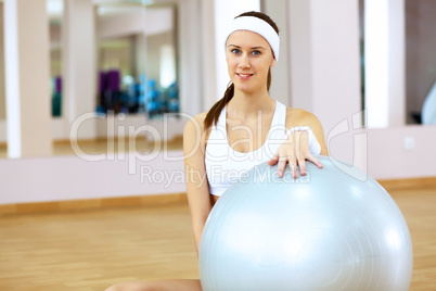 Woman in sport wear doing sport in gym