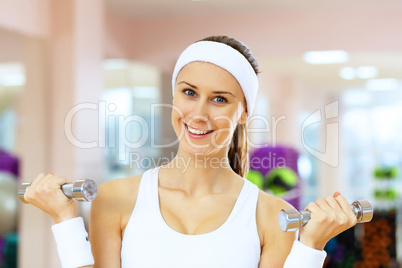 Woman in sport wear doing sport in gym