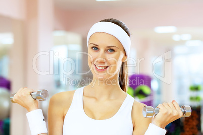 Woman in sport wear doing sport in gym