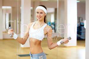 Woman in sport wear doing sport in gym