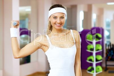 Woman in sport wear doing sport in gym