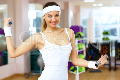 Woman in sport wear doing sport in gym