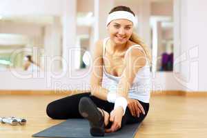 Woman in sport wear doing sport in gym