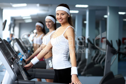 Woman in sport wear doing sport in gym