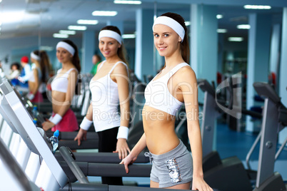 Woman in sport wear doing sport in gym