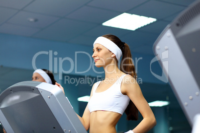 Woman in sport wear doing sport in gym