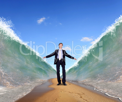 Businessman surfing on the sea waves