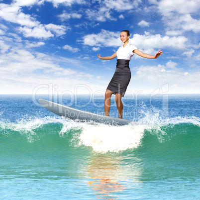 Businesswoman surfing on the sea waves