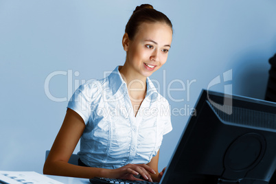 Young woman in business wear and headset