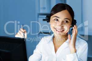 Young woman in business wear and headset