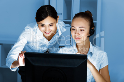 Young woman in business wear and headset