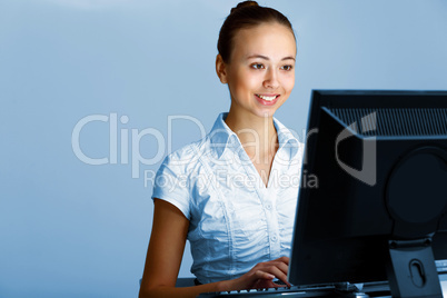 Young woman in business wear and headset