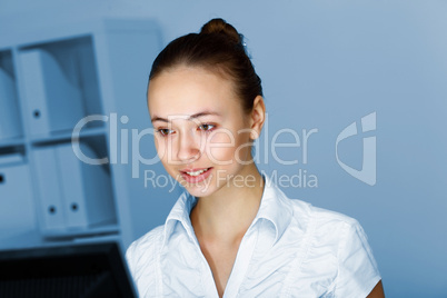 Young woman in business wear and headset