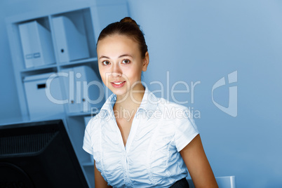 Young woman in business wear and headset