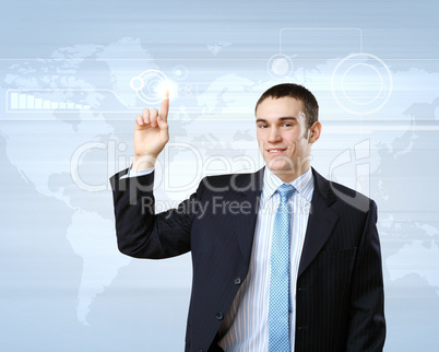 Businessman against technology background