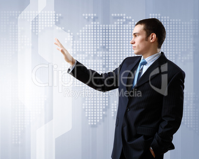 Businessman against technology background